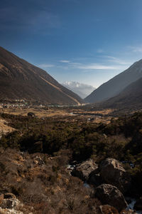 Scenic view of mountains valley against bright blue  sky at morning 