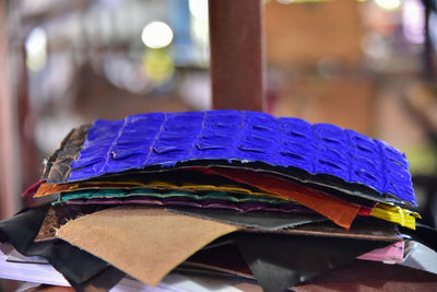 Close-up of blue paper for sale on table