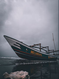 View of boat in sea against sky