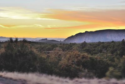 Scenic view of landscape against sky during sunset