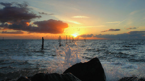 Scenic view of sea against sky during sunset
