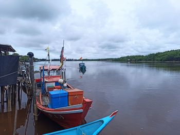 Boats in sea against sky