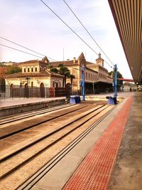 Railroad station platform against sky