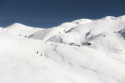 Low angle view of snowcapped mountain against sky