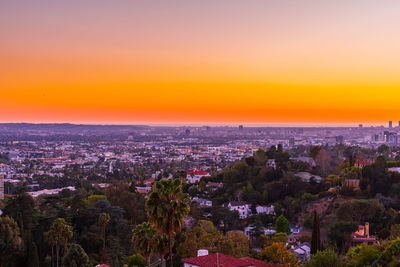 High angle view of buildings against sky during sunset