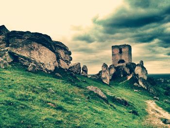 Scenic view of landscape against cloudy sky