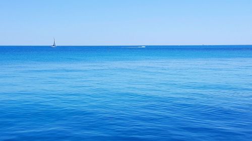 View of calm blue sea against clear sky