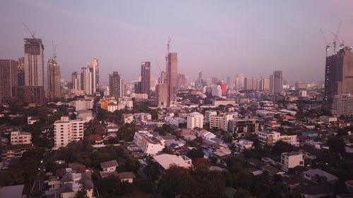 High angle view of modern buildings in city against sky