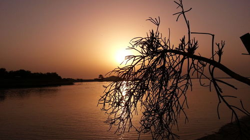 Scenic view of sunset over river