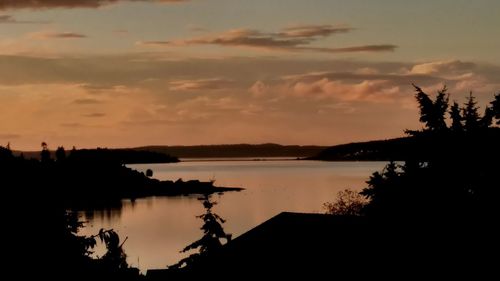 View of calm lake at sunset