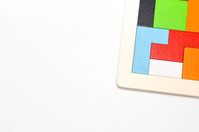 High angle view of colorful toy blocks on white background