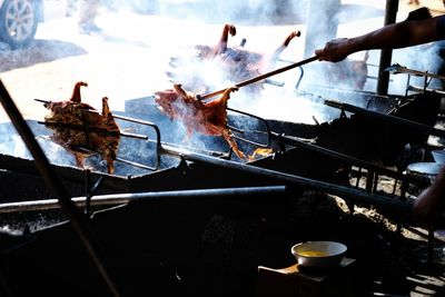 High angle view of people on barbecue grill
