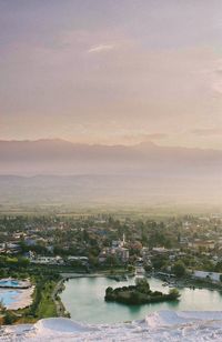 Aerial view of cityscape against sky