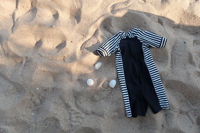 High angle view of shoes on sand