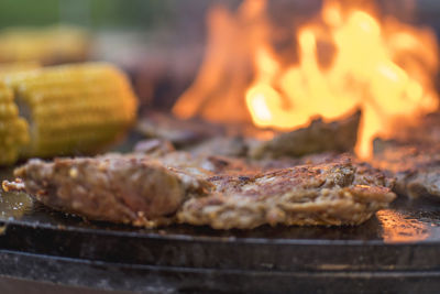 Close-up of meat on barbecue grill