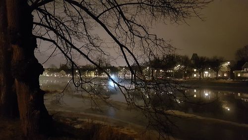 Scenic view of lake against sky at night