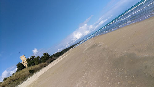 Panoramic view of beach against blue sky