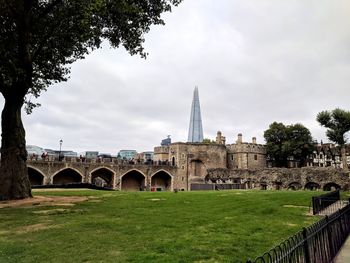 View of arch bridge and building against sky