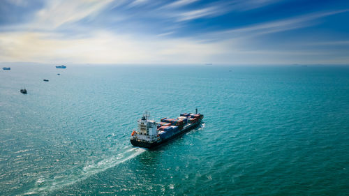 Boats in sea against sky