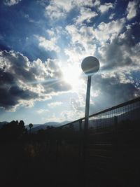 View of street light against cloudy sky