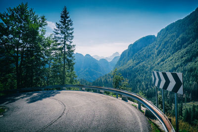 View from a serpentine road to a mountain range in the italian alps