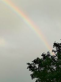 Low angle view of rainbow against sky