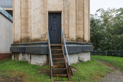 Exterior of house on field against building