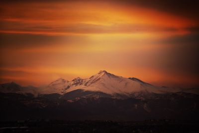 Scenic view of snowcapped mountain during sunset