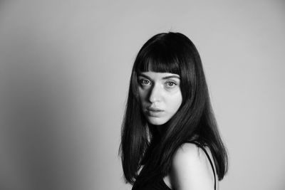 Portrait of woman against white background