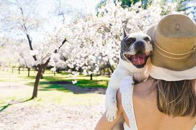 Rear view of woman with dog