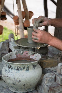 Man working on pottery wheel