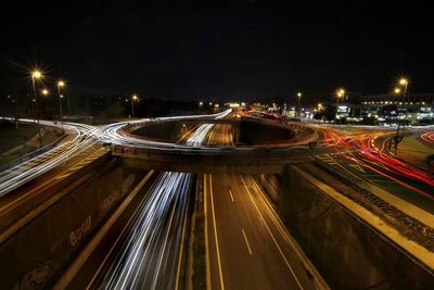 High angle view of light trails on road at night