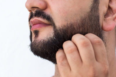 Midsection of man against white background