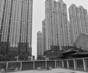Modern buildings against sky in city