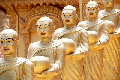 Buddha statues in row