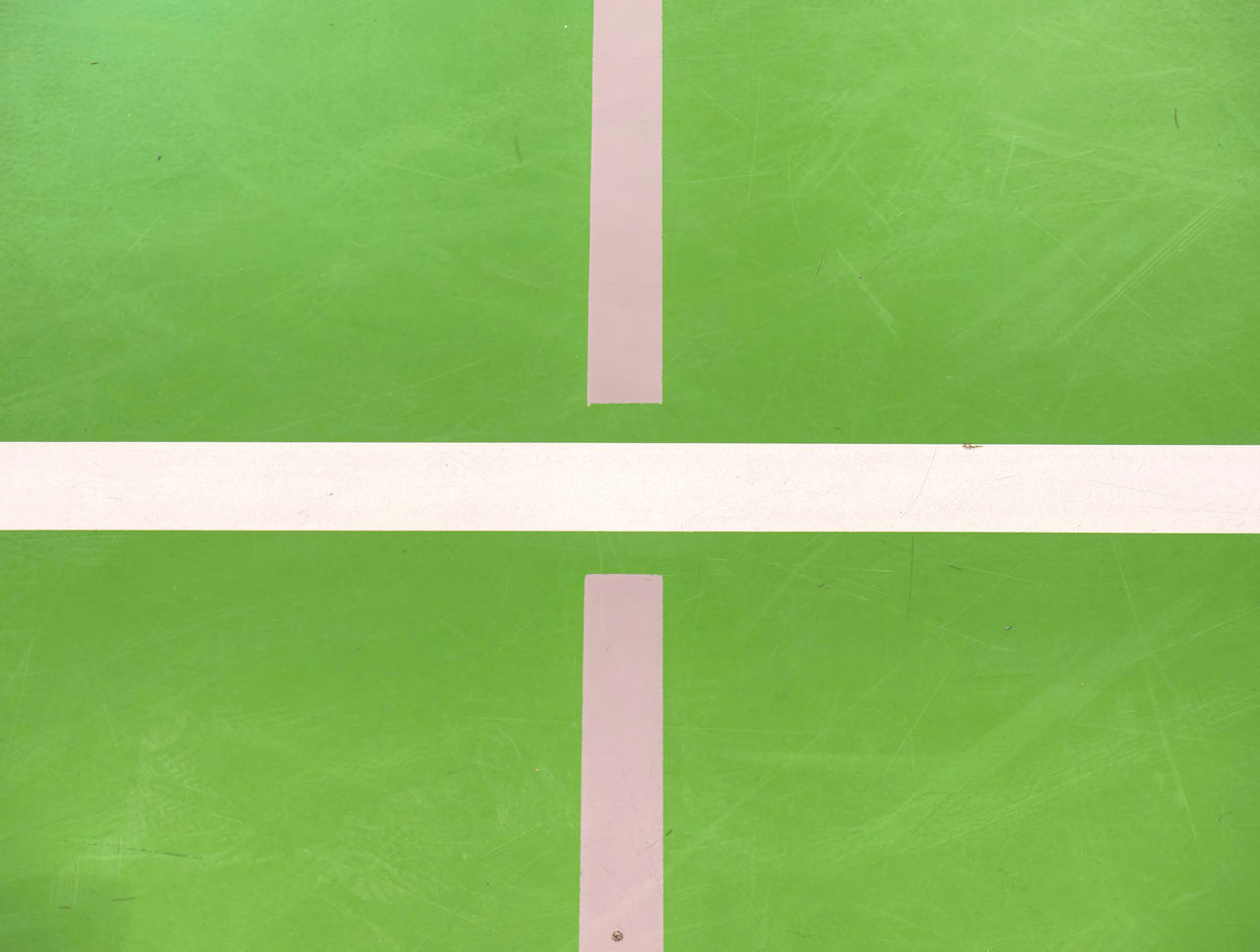 HIGH ANGLE VIEW OF GREEN BALL ON YELLOW WALL