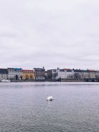 View of sea and buildings in city