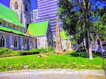 View of lawn and building against sky