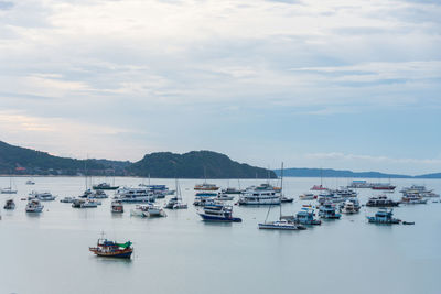 Boats in sea against sky