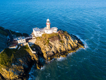 High angle view of buildings by sea