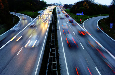 High angle view of light trails on highway at night