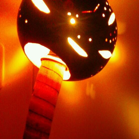 indoors, illuminated, lighting equipment, orange color, candle, close-up, glowing, decoration, art and craft, lantern, focus on foreground, lit, no people, creativity, burning, still life, art, single object, flame, human representation