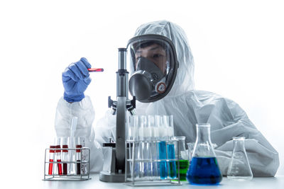 Man working against white background