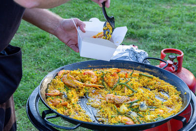 Midsection of person preparing food