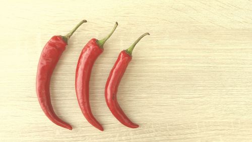 High angle view of red chili pepper on table