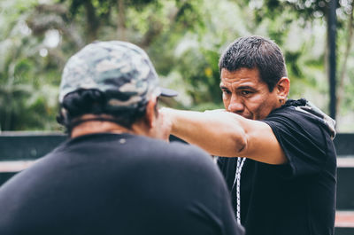 Man practicing boxing outdoors