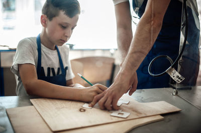 Boy working on table