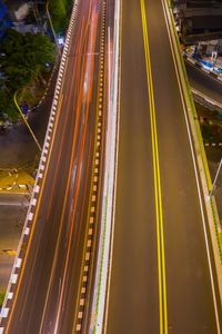 High angle view of light trails on road