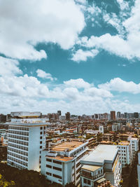 High angle view of buildings in city against sky