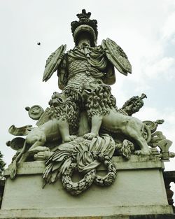 Low angle view of statue against sky